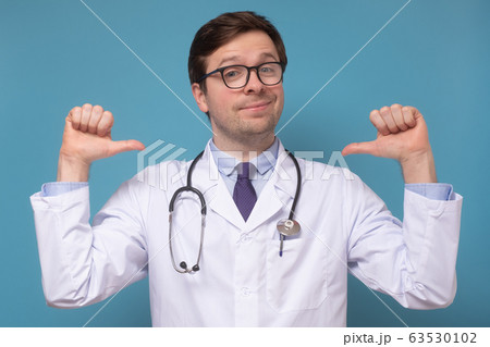 medical man intern or doctor feeling proud and medical man intern or doctor feeling proud and 63530102