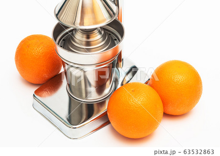 juicer with oranges on white background 63532863