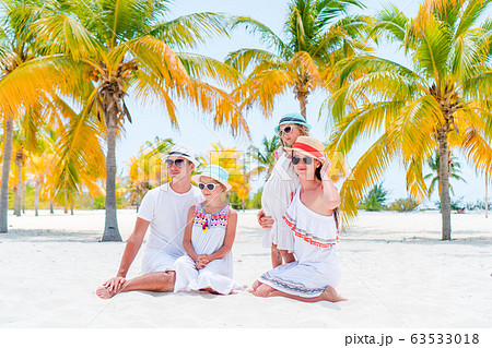Young family of four on summer vacation Young family of four on summer vacation 63533018