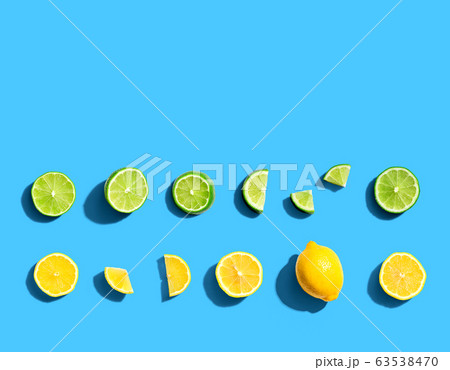 Fresh lemons and limes overhead view 63538470