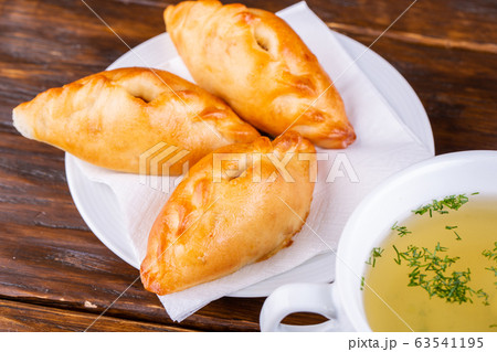 Baked cakes with meat and cabbage 63541195