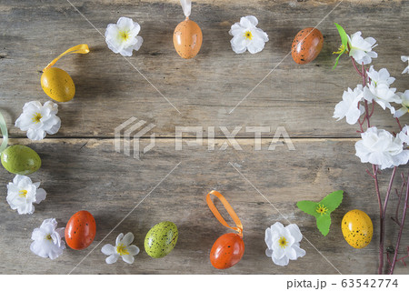 Frame of easter eggs and cherry blossom on old non Frame of easter eggs and cherry blossom on old non 63542774