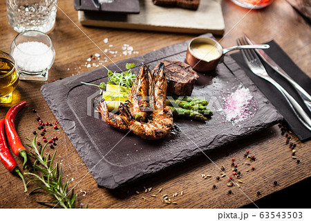 Tasting menu. Beef steak and grilled tiger prawns. 63543503