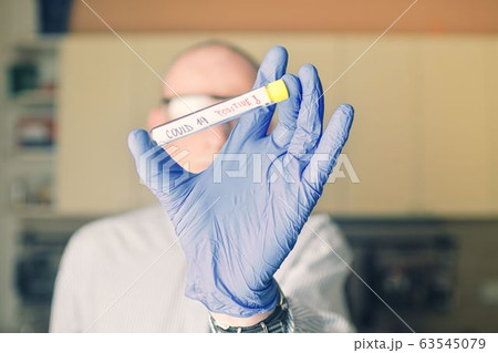 Doctor holds COVID 19 Coronavirus vaccine in his hand, infected sample in the sample tube, Vaccine and syringe injection It use for prevention, immunization and treatment from COVID-19. Doctor holds COVID 19 Coronavirus vaccine in his hand, infected sample in the sample tube, Vaccine and syringe injection It use for prevention, immunization and treatment from COVID-19. 63545079