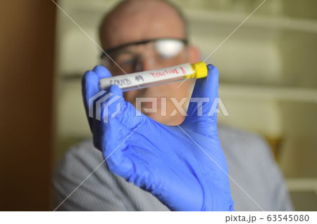 Doctor holds COVID 19 Coronavirus vaccine in his hand, infected sample in the sample tube, Vaccine and syringe injection It use for prevention, immunization and treatment from COVID-19. Doctor holds COVID 19 Coronavirus vaccine in his hand, infected sample in the sample tube, Vaccine and syringe injection It use for prevention, immunization and treatment from COVID-19. 63545080