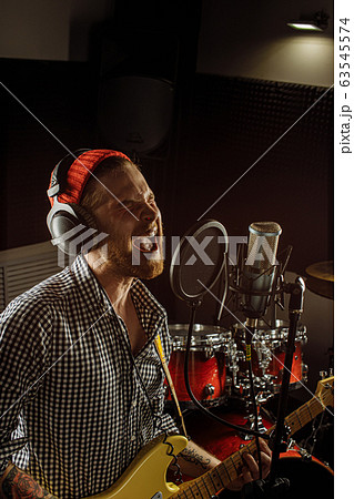 awesome musician play electric guitar and sing awesome musician play electric guitar and sing 63545574