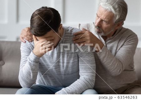 Caring elderly father comfort upset adult son Caring elderly father comfort upset adult son 63546263