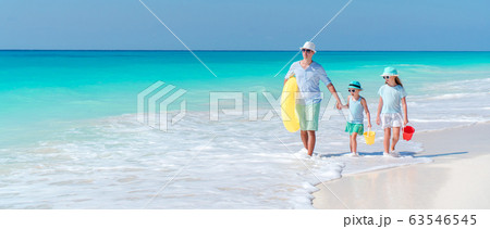 Happy beautiful family on a tropical beach vacation Happy beautiful family on a tropical beach vacation 63546545
