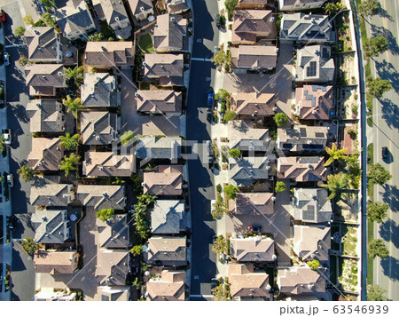 Aerial top view of upper middle class neighborhood with residential house next to each other Aerial top view of upper middle class neighborhood with residential house next to each other 63546939