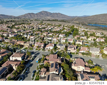 Aerial view of upper middle class neighborhood with identical residential subdivision house 63547024