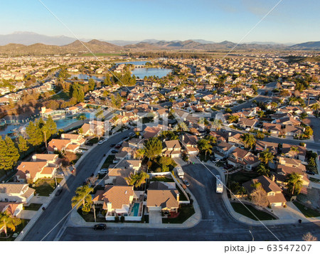 Aerial view of Menifee neighborhood, residential subdivision vila during sunset. Aerial view of Menifee neighborhood, residential subdivision vila during sunset. 63547207