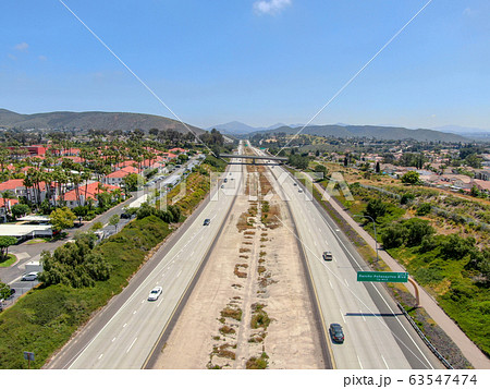 Aerial view of highway with vehicle movement. California, USA. Aerial view of highway with vehicle movement. California, USA. 63547474