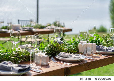 Beautifully decorated wooden table in a summer 63556580