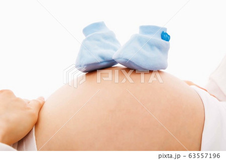 woman pregnant and blue ribbon ribbin shoes 63557196