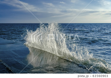 Splashing wave on the Black sea in the sunny day. 63560903