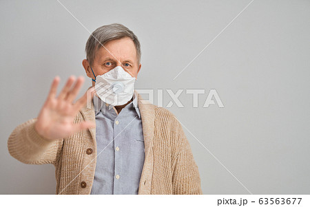 Old man wearing facemask Old man wearing facemask 63563677