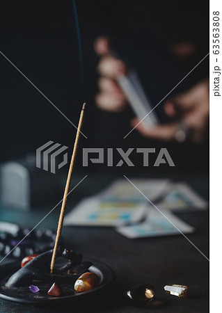 Tarot cards are surrounded magic things on a table.Mystical and occult concept 63563808