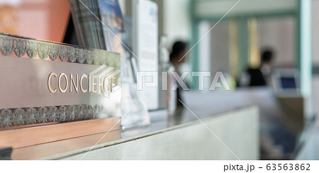 Concierge service counter of hotel, restaurant or apartment's front desk in luxury reception hall in Thailand with staff working for serving tourist guest or check-in customers Concierge service counter of hotel, restaurant or apartment's front desk in luxury reception hall in Thailand with staff working for serving tourist guest or check-in customers 63563862