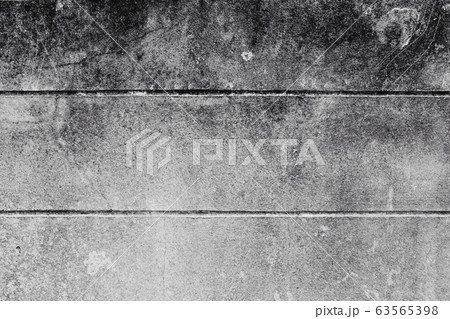 Close-up of White cement wall peeled paint caused by water and sunlight. Peel wall with line of White house paint with black stain. Black and White of Texture background. 63565398