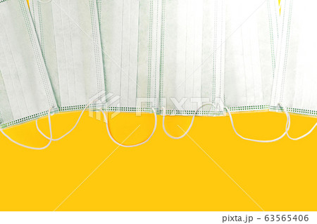 Medical masks on yellow color background. Medical masks on yellow color background. 63565406