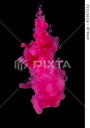 Abstract flowing pink color ink in water on black background Abstract flowing pink color ink in water on black background 63567332