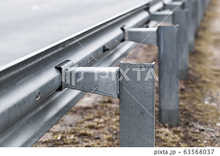 Metal guardrail construction mounted on a highway 63568037
