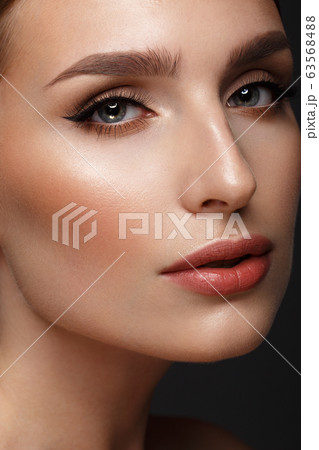 Beautiful girl with sexy lips and classic makeup . Beauty face. Beautiful girl with sexy lips and classic makeup . Beauty face. 63568488