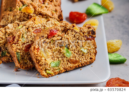 Pieces of dried fruit bread on a gray plate. Pieces of dried fruit bread on a gray plate. 63570824