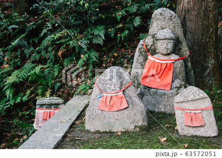 Buddha statue wearing red apron at Kiyomizu-dera temple in Kyoto, Japan Buddha statue wearing red apron at Kiyomizu-dera temple in Kyoto, Japan 63572051