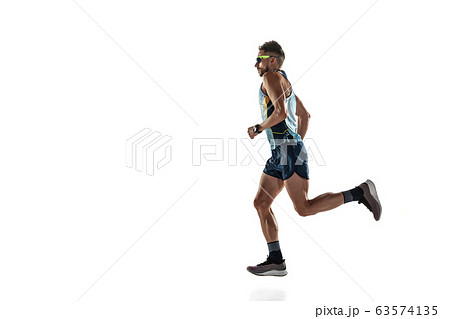 Triathlon male athlete running isolated on white studio background 63574135