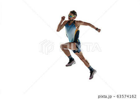 Triathlon male athlete running isolated on white studio background 63574162