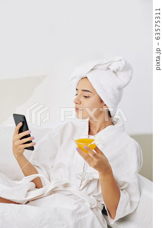 Young woman resting after taking bath 63575311