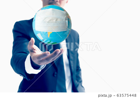 Human hand holding world globe with face mask Concept worldwide for COVID 19. Human hand holding world globe with face mask Concept worldwide for COVID 19. 63575448