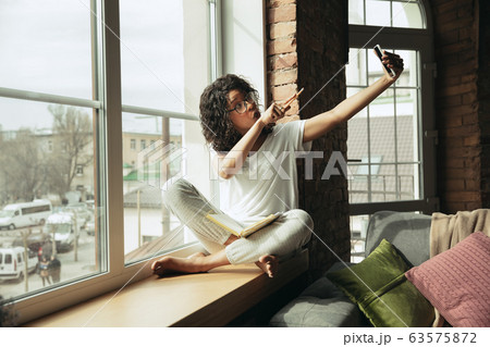 African-american woman, freelancer during the work in home office while quarantine African-american woman, freelancer during the work in home office while quarantine 63575872
