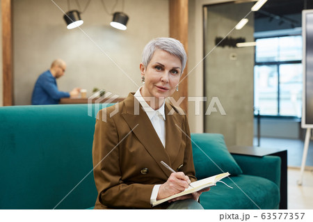 Modern Mature Businesswoman Looking at Camera 63577357