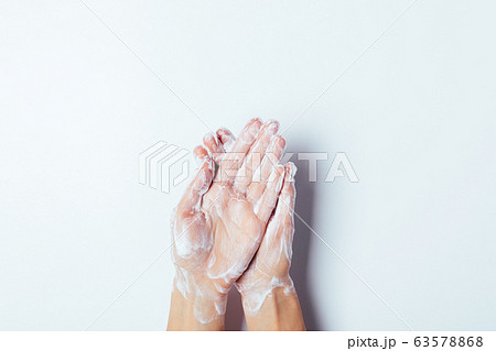 Process of washing hands with soap on white 63578868