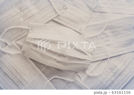 coronavirus pandemic. Medical mask for protection against flu and other diseases. 63581156