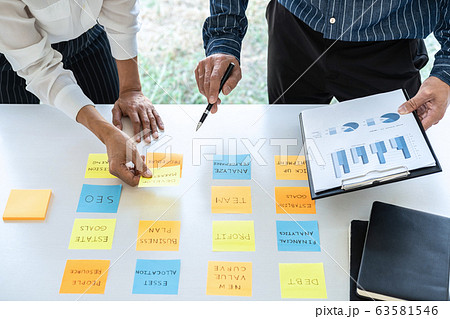Two creative business people meeting and planning Two creative business people meeting and planning 63581546