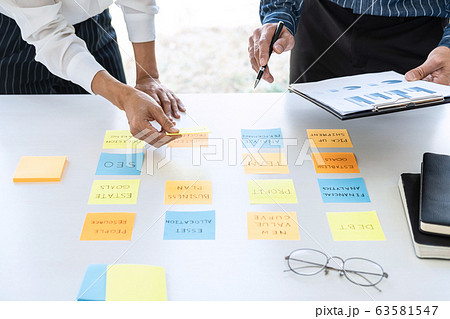 Two creative business people meeting and planning Two creative business people meeting and planning 63581547