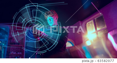 Man using interface modern technology and digital layer effect, VR-headset as business, finance, economics strategy concept Man using interface modern technology and digital layer effect, VR-headset as business, finance, economics strategy concept 63582077