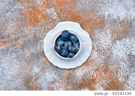 Top view of porcelain bowl with fresh blueberry Top view of porcelain bowl with fresh blueberry 63583190