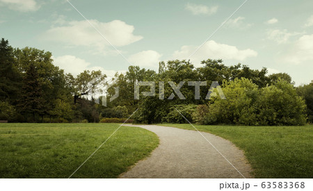 Panorama of public city park with footpath 63583368