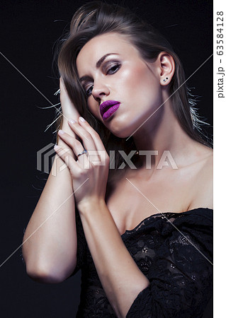 young lady posing emotional on black background, lifestyle people concept young lady posing emotional on black background, lifestyle people concept 63584128