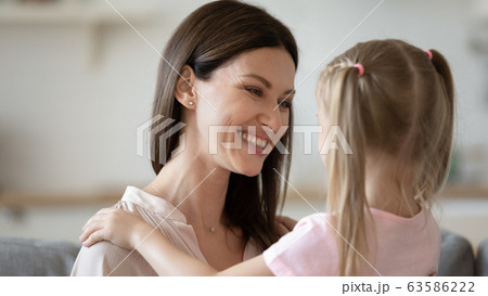 Happy mother and daughter hug showing love Happy mother and daughter hug showing love 63586222