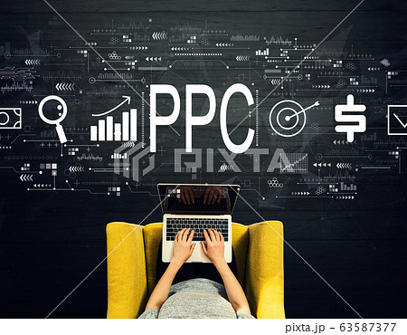 PPC - Pay per click concept with person using a laptop PPC - Pay per click concept with person using a laptop 63587377