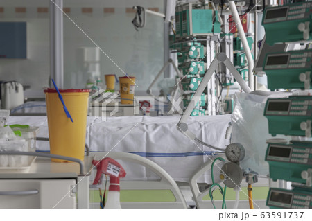 Intensive care unit in hospital, beds with infusion pumps Intensive care unit in hospital, beds with infusion pumps 63591737