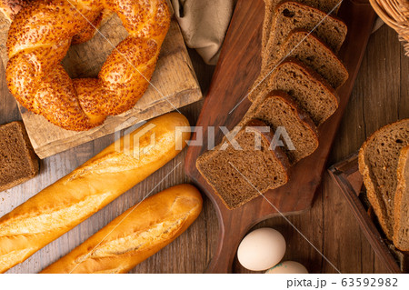 French baguette with turkish bagels and slices of bread 63592982