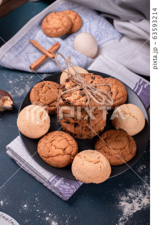 Plate of sweeties and biscuits on table 63593214