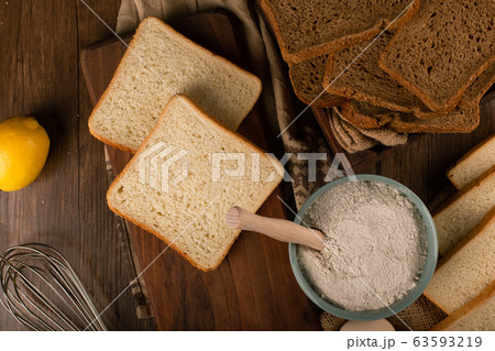 A bowl of flour with slices of bread A bowl of flour with slices of bread 63593219
