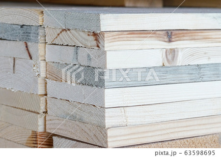 Stacked pine wood in a warehouse. Wood processing, Stacked pine wood in a warehouse. Wood processing, 63598695